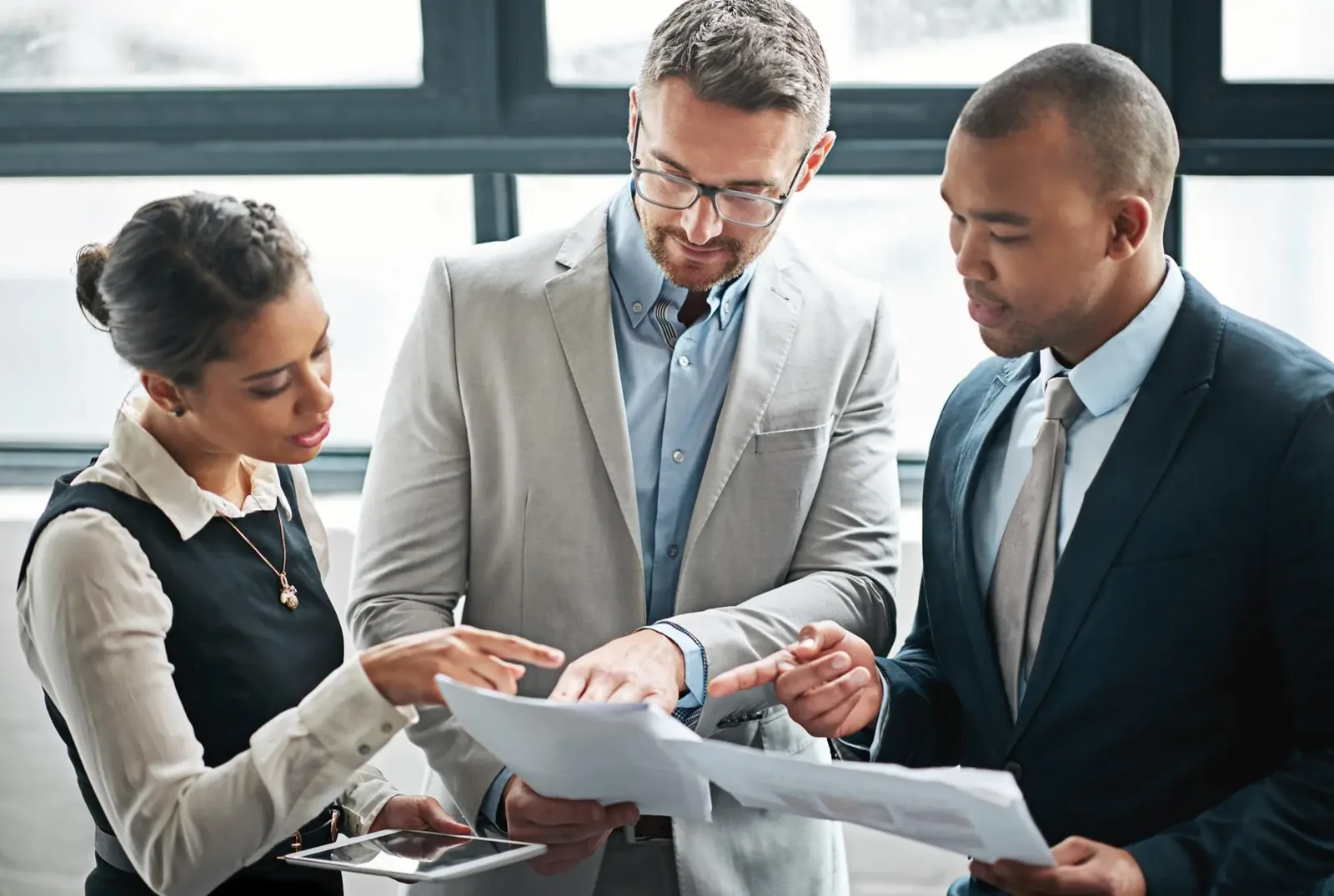 Documents meeting and business people in discussion for planning advice and collaboration Corporate office teamwork and men and woman with p